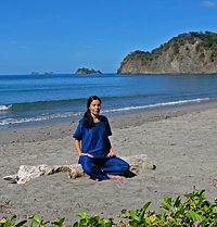Diksha meditates on the beach