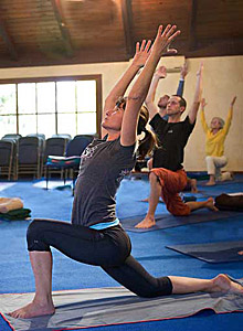 Practicing poses in class at The Expanding Light Retreat