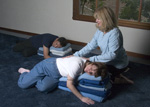 Restorative Yoga Teacher trainer showing how to do assana