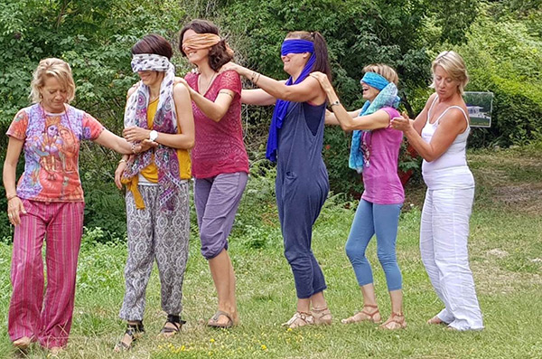 A blind trust walk during Sharing Ananda Yoga with Children