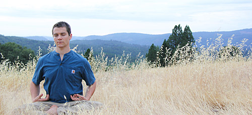 Badri meditating in the meadow at The Expanding Light Retreat