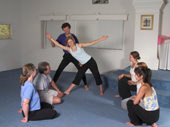 Assisting a yoga student