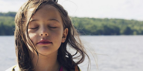 Image of childs face meditating