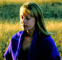 girl meditating in a purple shawl