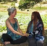 New friends sitting by Lotus Lake at The Expanding Light Retreat