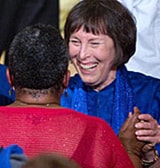 anandi smiles with guests at The Expanding Light Retreat