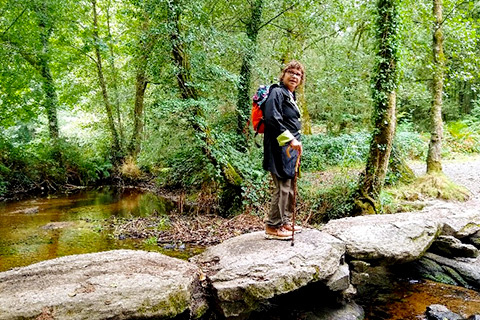 Ananda Spiritual Travels-Camino Pilgrimage-Pilgrim walking over a bridge