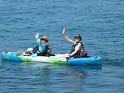 kayakers waving