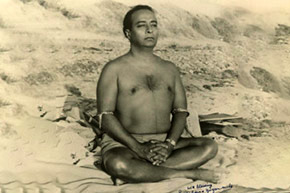Yogananda meditating at beach